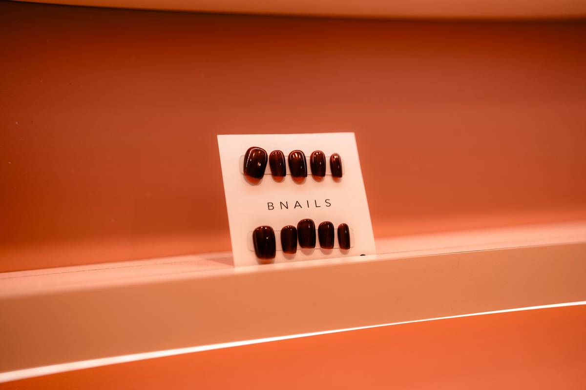 A manicurist using high-quality salon nail equipment