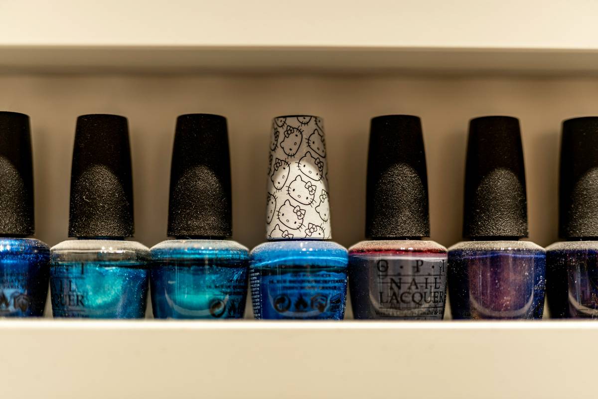 Sarah posing proudly with flawless nail artwork done using her premium kit