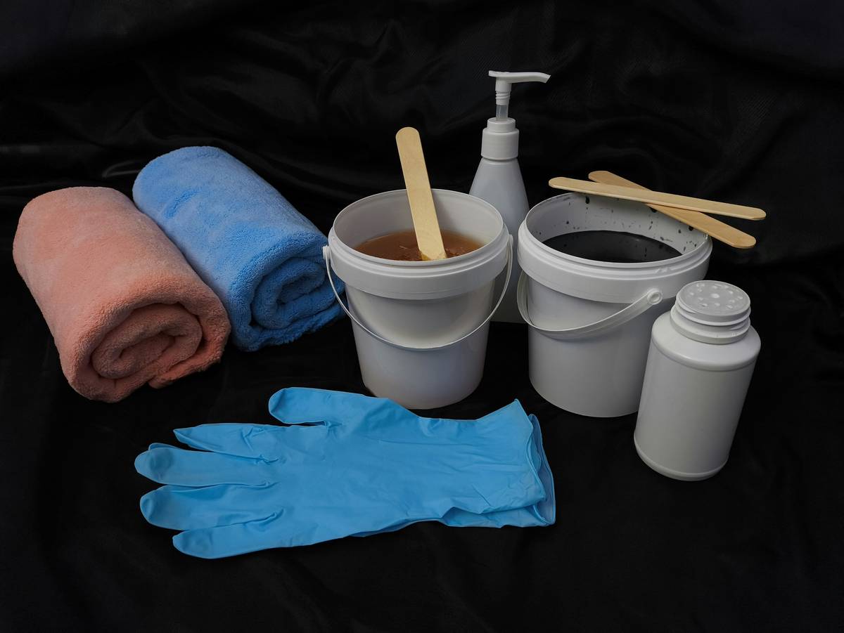 A close-up shot of multiple spools of colorful professional nail tape arranged neatly on a white background.