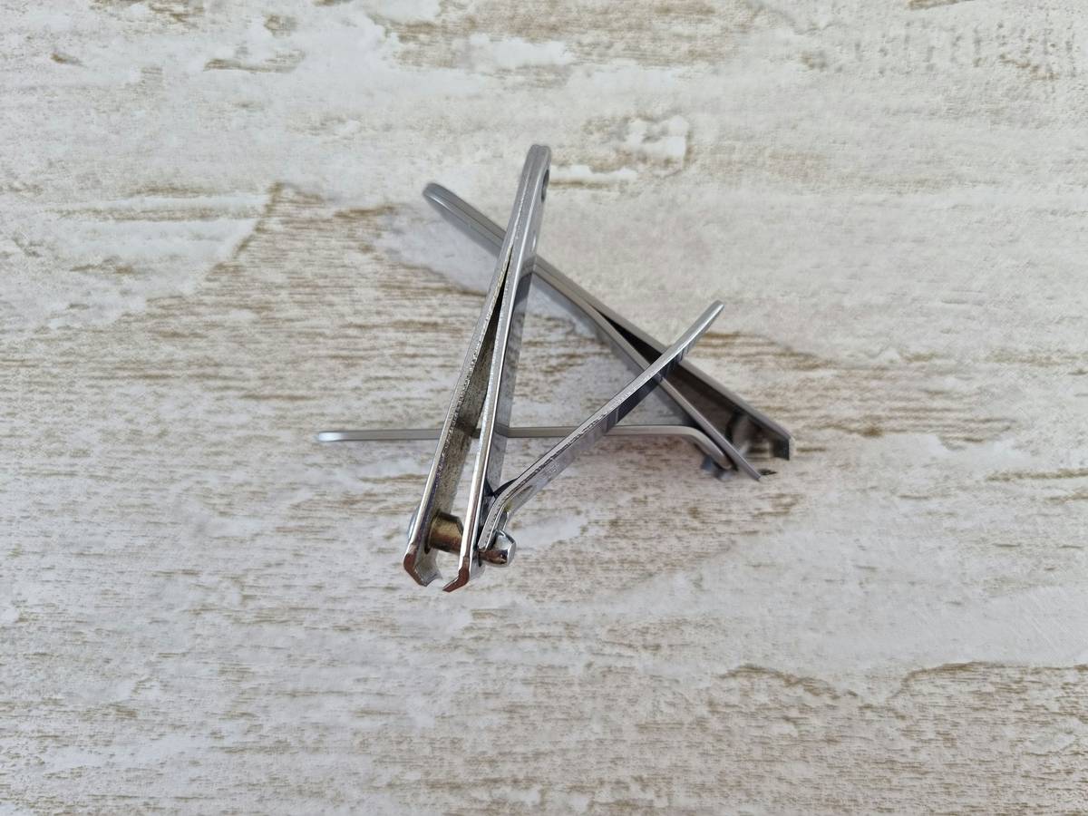 A set of professional nail art transfer tools including decals, sliders, and brushes.