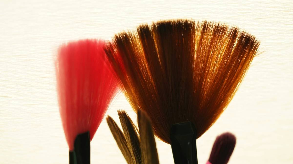 Side-by-side comparison: high-quality kolinsky sable brush vs. cheap synthetic brush showing bristle integrity and tip precision