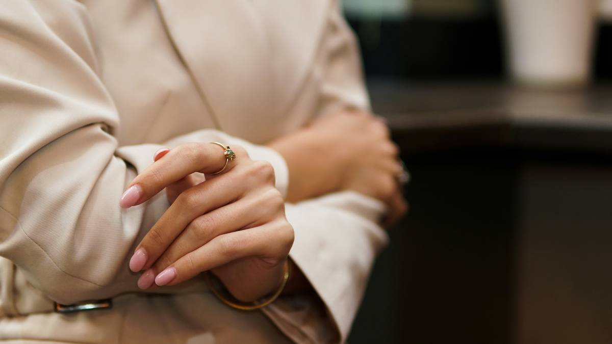 a woman with her hands on her chest