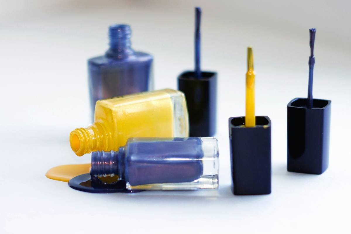 Glass bottles with pouring nail polish. Don't forget to credit the author, please)