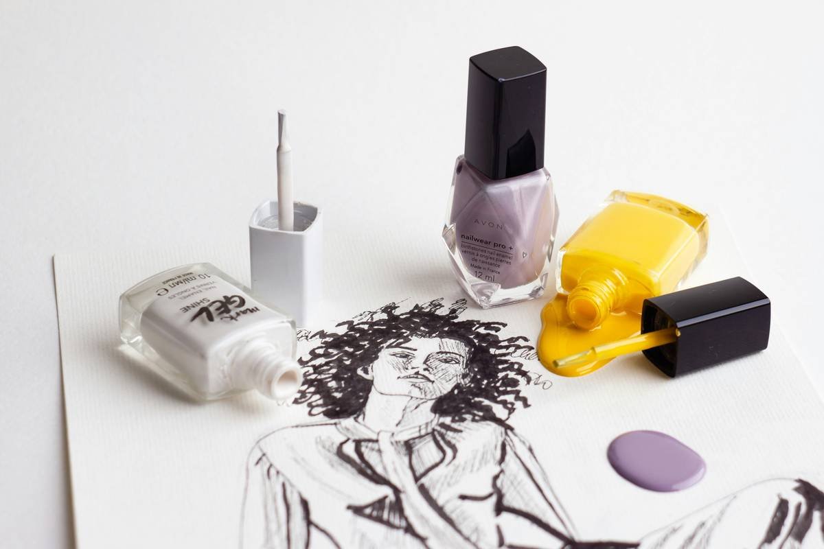 Hand-drawn sketch of a fashionable young woman and bright bottles with pouring nail polish. P. S. If you like my work and want to support me, there is an option to buy a coffee (paypal link in profile). Thank you!