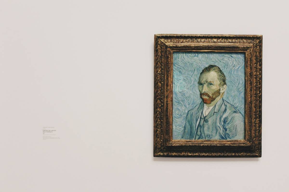 Close-up of professional nail art tools and durable stainless steel brushes on a clean white workspace